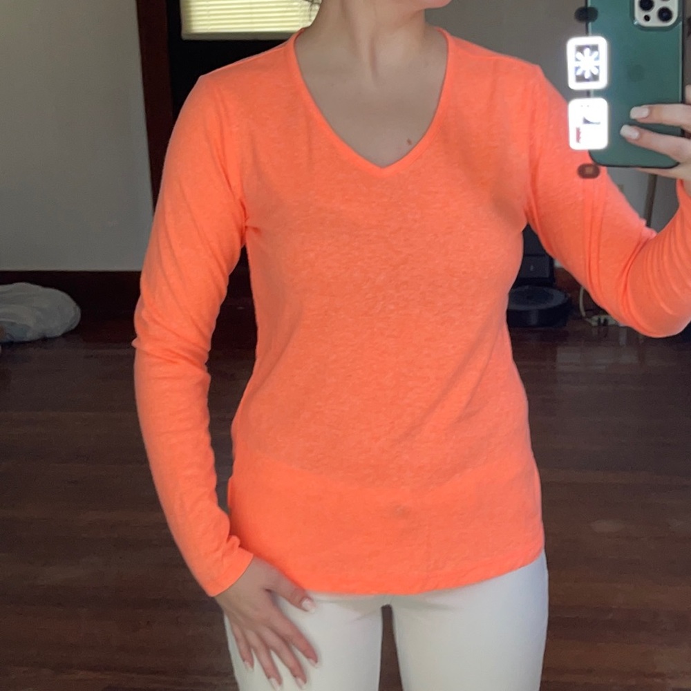 Small orange long sleeve shirt